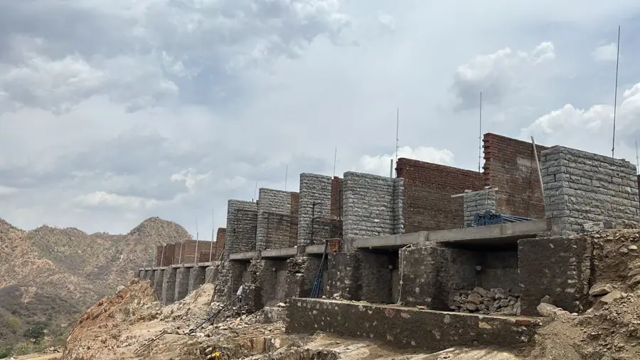 Madar Lake Resort stone-masonry villas under construction